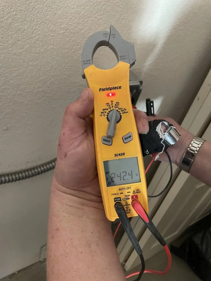 Voltage testing with clamp meter during Outlet Installation in Olyphant